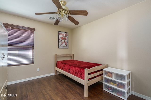 bedroom featuring ceiling fan and dark wood-type flooring