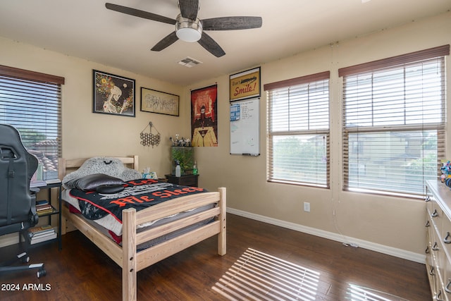 bedroom featuring dark hardwood / wood-style floors and ceiling fan