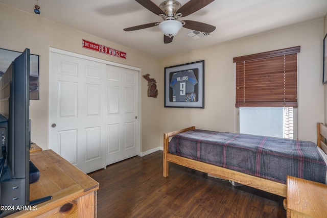 bedroom featuring a closet, ceiling fan, and dark wood-type flooring