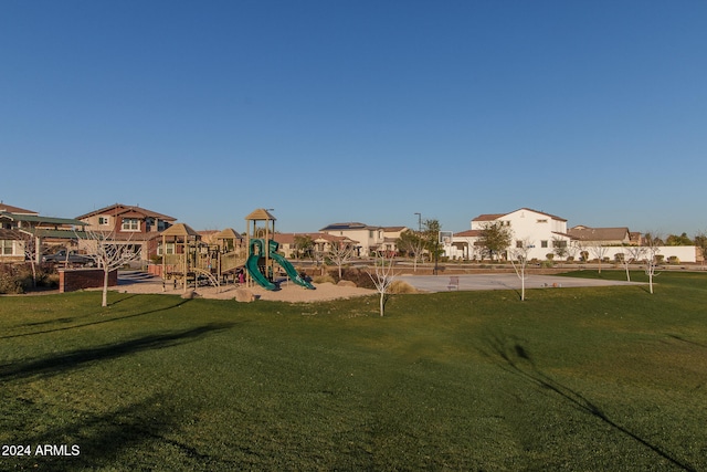 view of playground with a yard