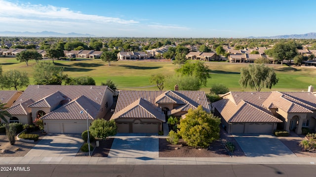 birds eye view of property with a mountain view