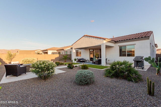 17896 W Amberwood Dr, Goodyear, AZ 85338 - back of house with a patio area, a tile roof, and an outdoor hangout area