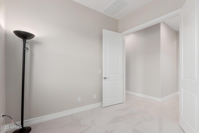 17896 W Amberwood Dr, Goodyear, AZ 85338 - unfurnished bedroom with light colored carpet, baseboards, and visible vents