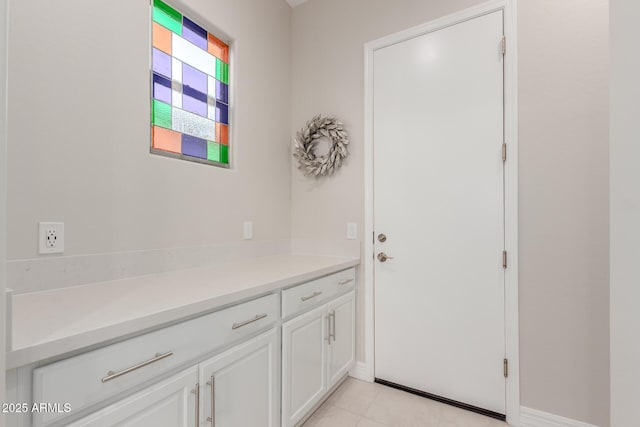 17896 W Amberwood Dr, Goodyear, AZ 85338 - doorway to outside with light tile patterned floors and baseboards