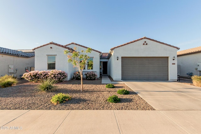 17896 W Amberwood Dr, Goodyear, AZ 85338 - mediterranean / spanish house featuring driveway, stucco siding, a tile roof, and a garage