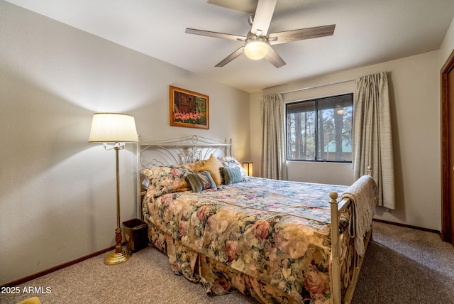 bedroom featuring baseboards, ceiling fan, and carpet flooring