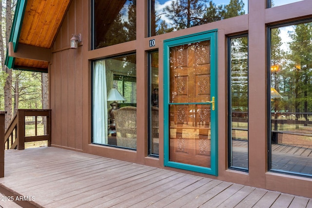 entrance to property featuring a wooden deck