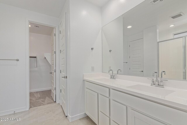 4371 E Enmark Dr, San Tan Valley, AZ 85143 - bathroom featuring double vanity, recessed lighting, and a walk in closet
