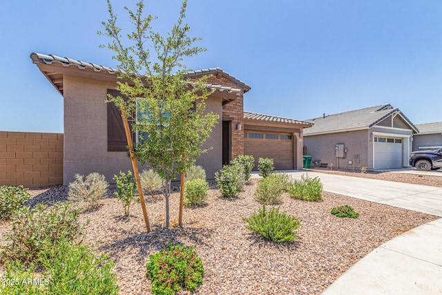 4371 E Enmark Dr, San Tan Valley, AZ 85143 - view of front of home featuring a garage, concrete driveway, a tiled roof, and stucco siding