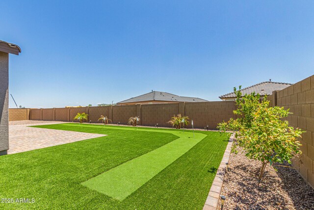 4371 E Enmark Dr, San Tan Valley, AZ 85143 - fenced backyard with an area to practice putting and a patio area