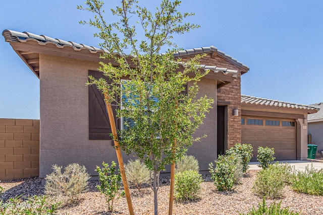 4371 E Enmark Dr, San Tan Valley, AZ 85143 - view of front of home featuring a tiled roof, stucco siding, an attached garage, and driveway