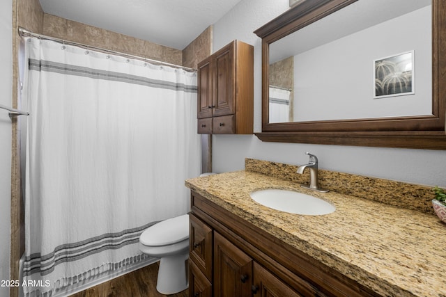 1408 N 62nd Pl, Mesa, AZ 85205 - bathroom with vanity, toilet, wood finished floors, and curtained shower