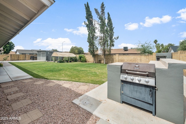 1408 N 62nd Pl, Mesa, AZ 85205 - view of yard featuring a patio area and exterior kitchen
