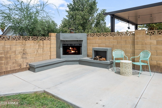 1408 N 62nd Pl, Mesa, AZ 85205 - view of patio featuring a lit fireplace