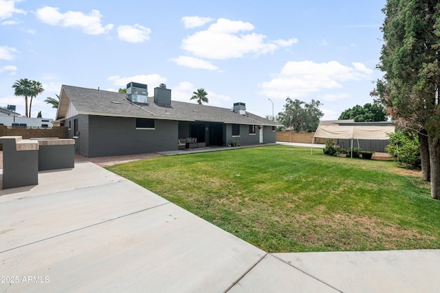1408 N 62nd Pl, Mesa, AZ 85205 - rear view of house with a patio area, a chimney, and central AC unit