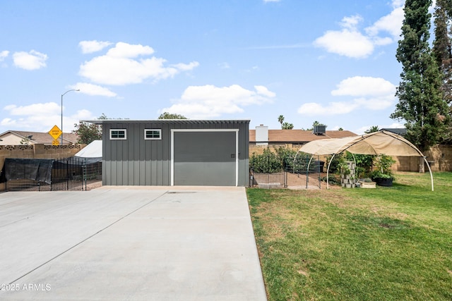 1408 N 62nd Pl, Mesa, AZ 85205 - view of yard with a detached garage, an outdoor structure, and concrete driveway