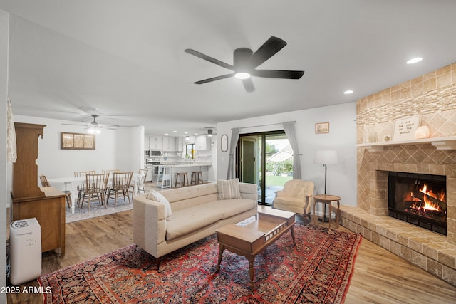 1408 N 62nd Pl, Mesa, AZ 85205 - living area with ceiling fan, wood finished floors, a fireplace, and recessed lighting
