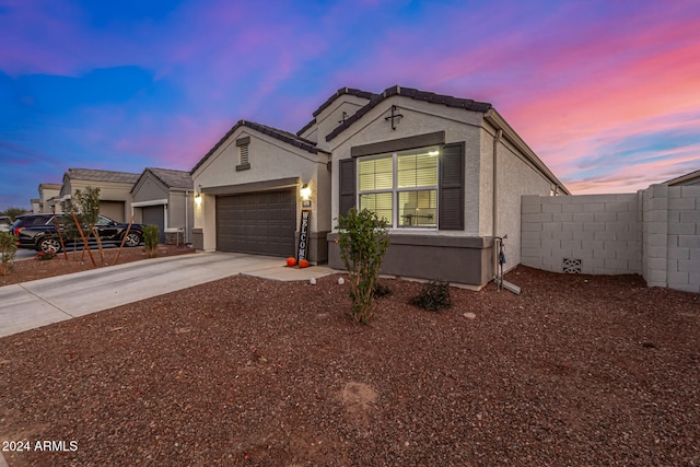 single story home with a garage