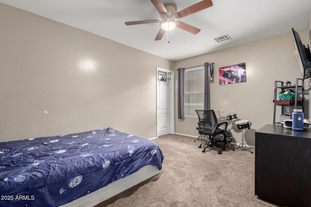 bedroom with carpet floors, visible vents, baseboards, and ceiling fan
