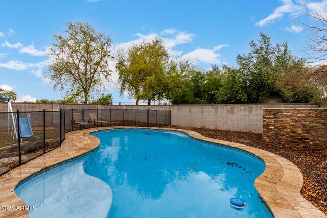 view of swimming pool featuring a fenced in pool and a fenced backyard