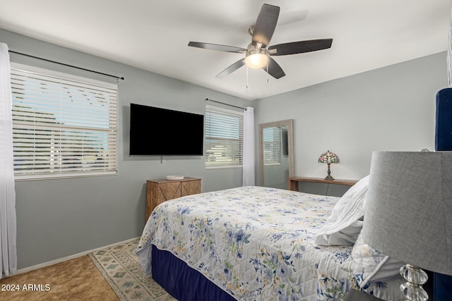 bedroom featuring baseboards and a ceiling fan