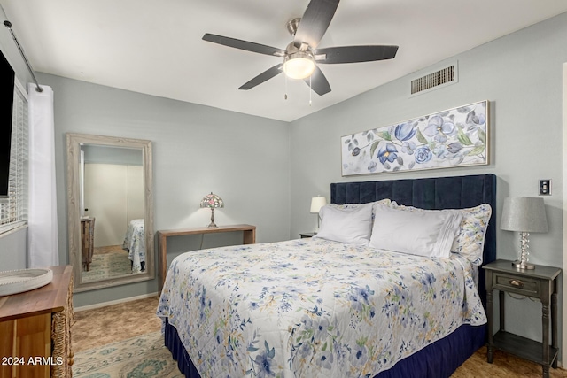 bedroom with ceiling fan, visible vents, and baseboards