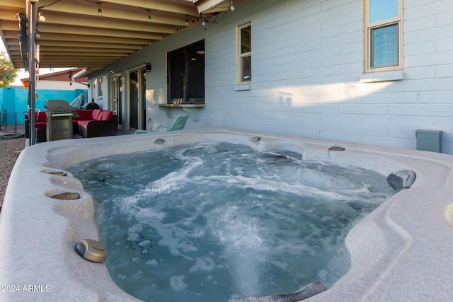 exterior space featuring a grill and a hot tub