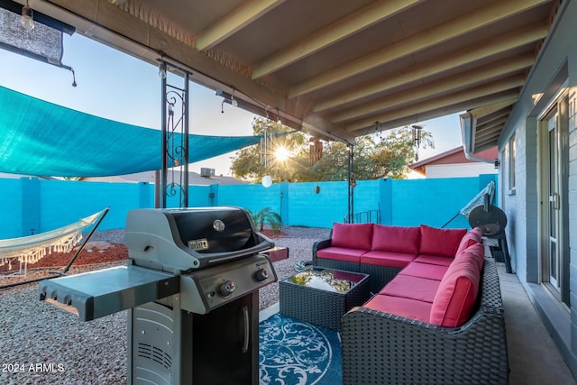 view of patio featuring an outdoor hangout area, a fenced backyard, and a grill