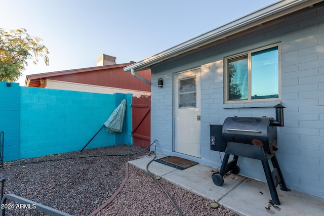 view of exterior entry with fence