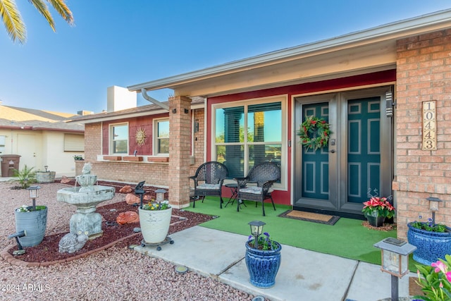 exterior space featuring brick siding and a lawn