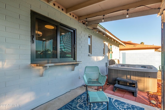 view of patio / terrace featuring a hot tub