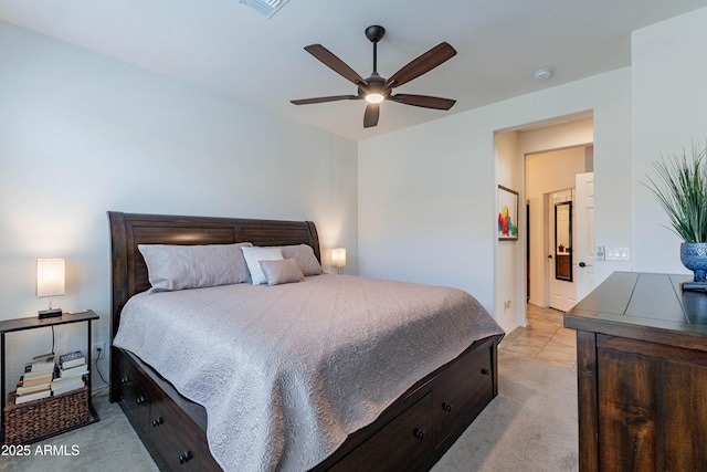 bedroom with a ceiling fan, light colored carpet, and visible vents