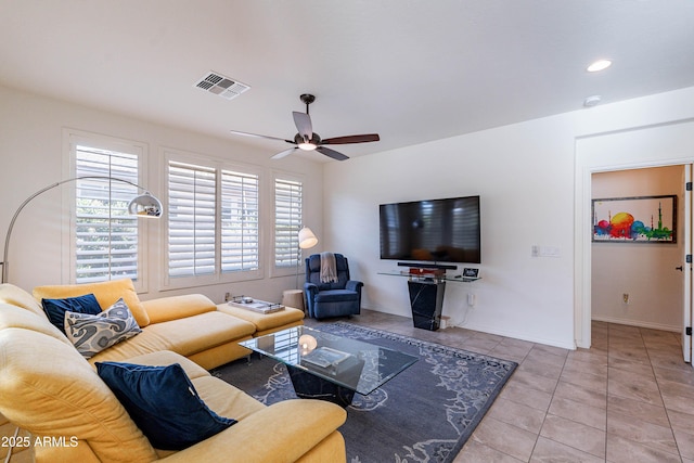 living area with tile patterned flooring, visible vents, baseboards, recessed lighting, and a ceiling fan