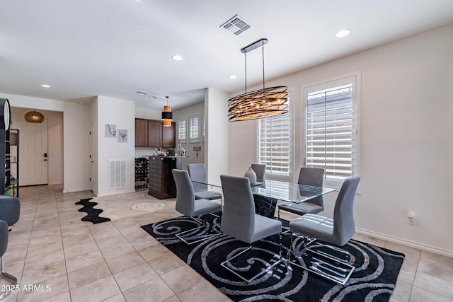 dining room with recessed lighting, baseboards, visible vents, and light tile patterned floors