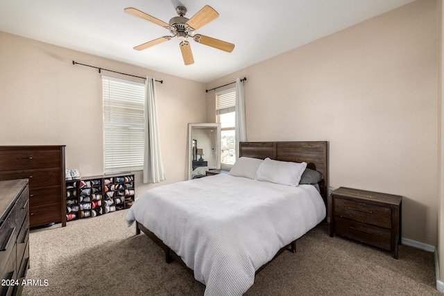 bedroom featuring light carpet and ceiling fan