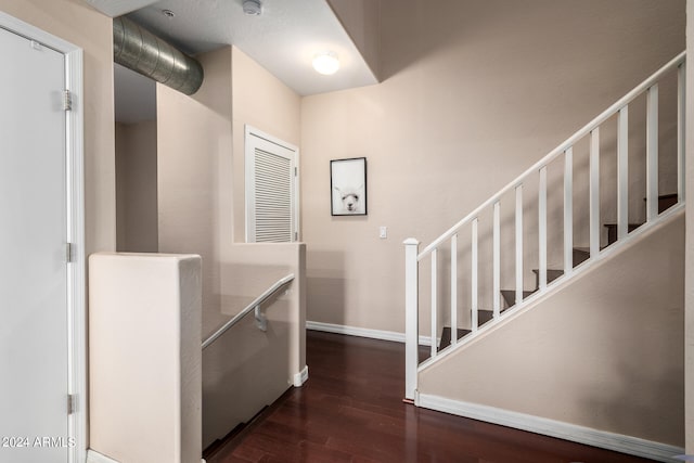 entrance foyer featuring dark wood-type flooring