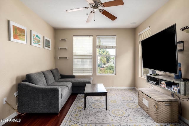 living room featuring ceiling fan and hardwood / wood-style floors