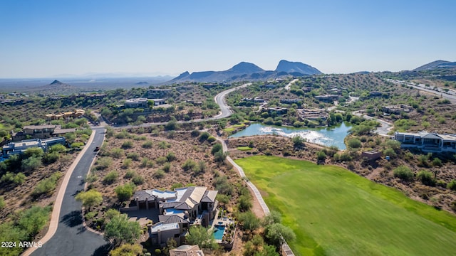 drone / aerial view featuring a water and mountain view