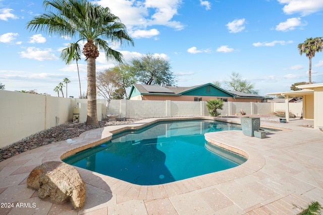 view of swimming pool featuring a patio