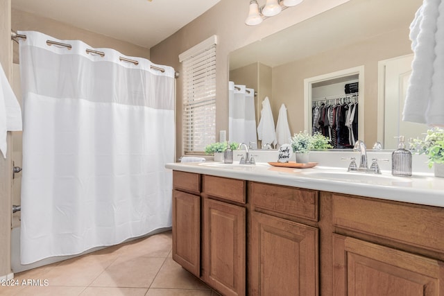 bathroom featuring vanity, tile patterned floors, and curtained shower