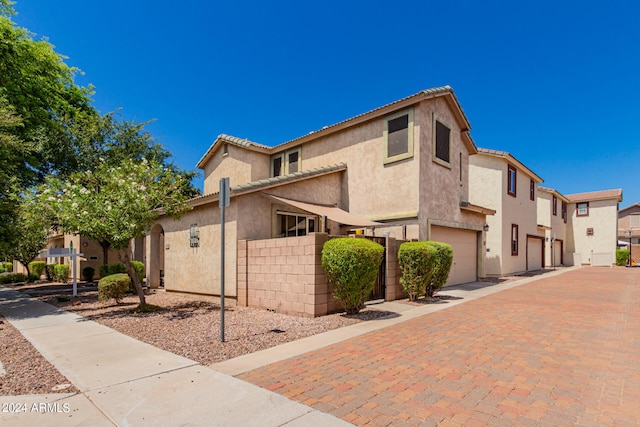 view of front of property with a garage