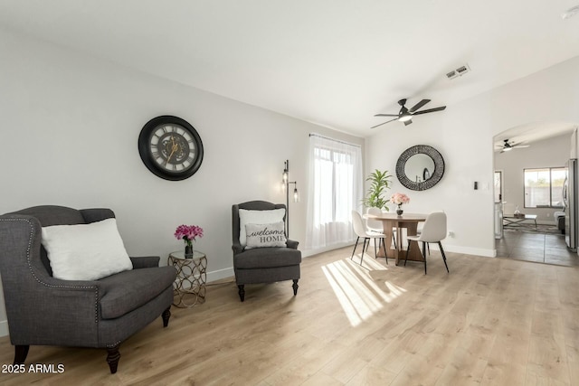 sitting room featuring ceiling fan and light hardwood / wood-style flooring