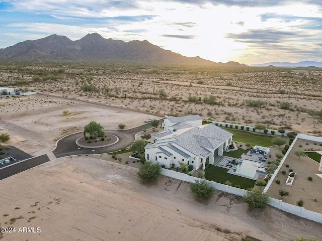 birds eye view of property with a mountain view