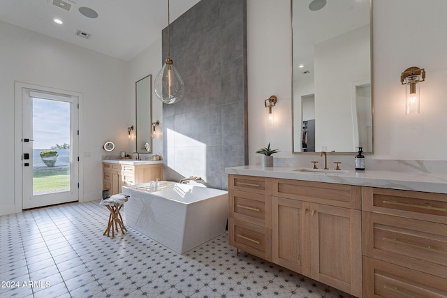 bathroom with vanity and a bathtub