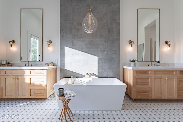 bathroom with vanity and a tub to relax in