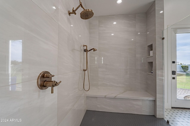 bathroom with a wealth of natural light and tiled shower