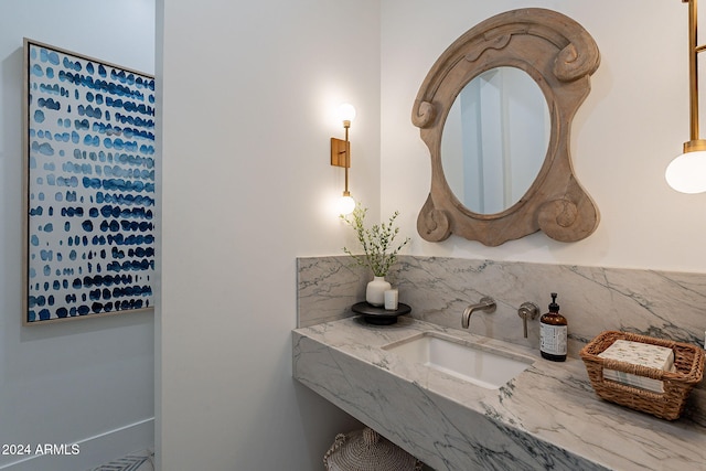 bathroom with vanity and backsplash