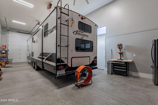 garage featuring stainless steel fridge