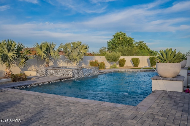 view of pool featuring a patio and pool water feature