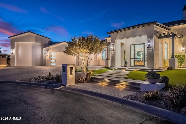 view of front of property with a garage